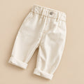 Beige shorts on a textured surface