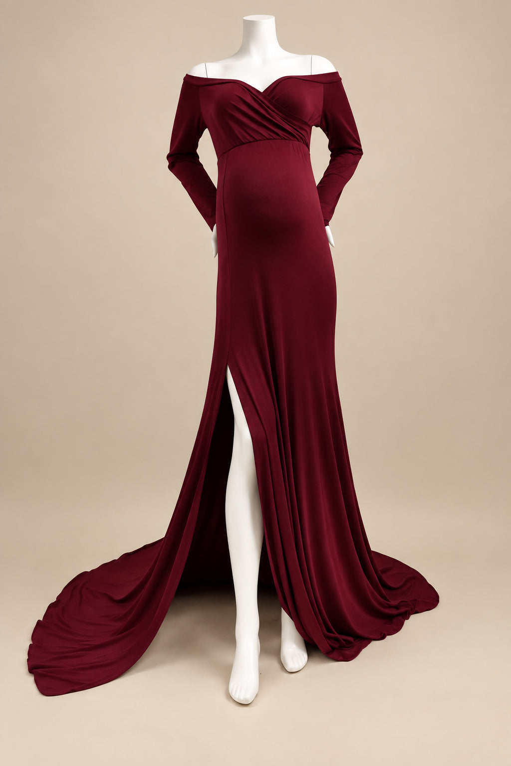 Burgundy evening gown on a mannequin against a plain background