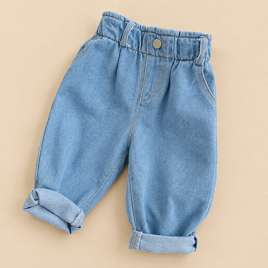 Light blue denim pants on a woven surface