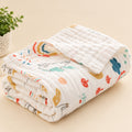 Folded baby blanket with colorful animal pattern on a white surface