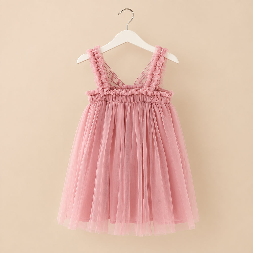 Pink dress on a hanger against a white background