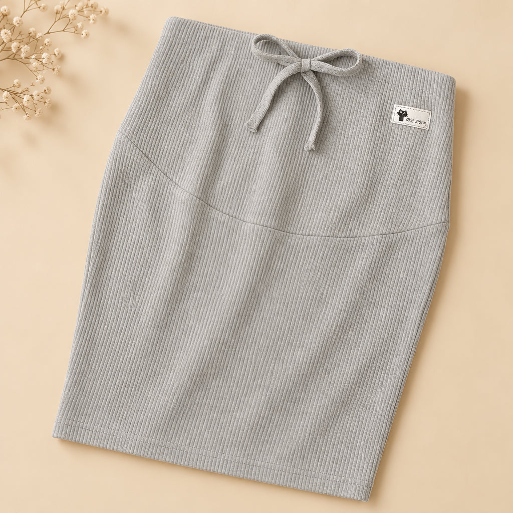 Gray ribbed pajama pants with a bow detail on a light background