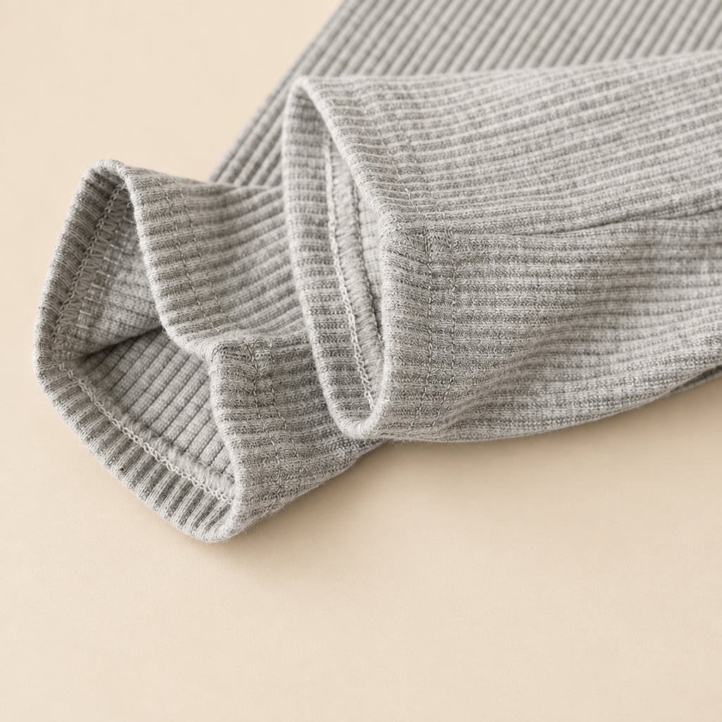 Gray textured fabric roll on a white background