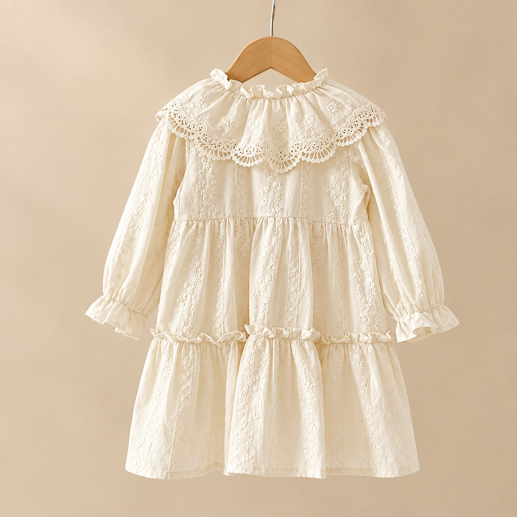 White lace dress on a wooden hanger against a white background