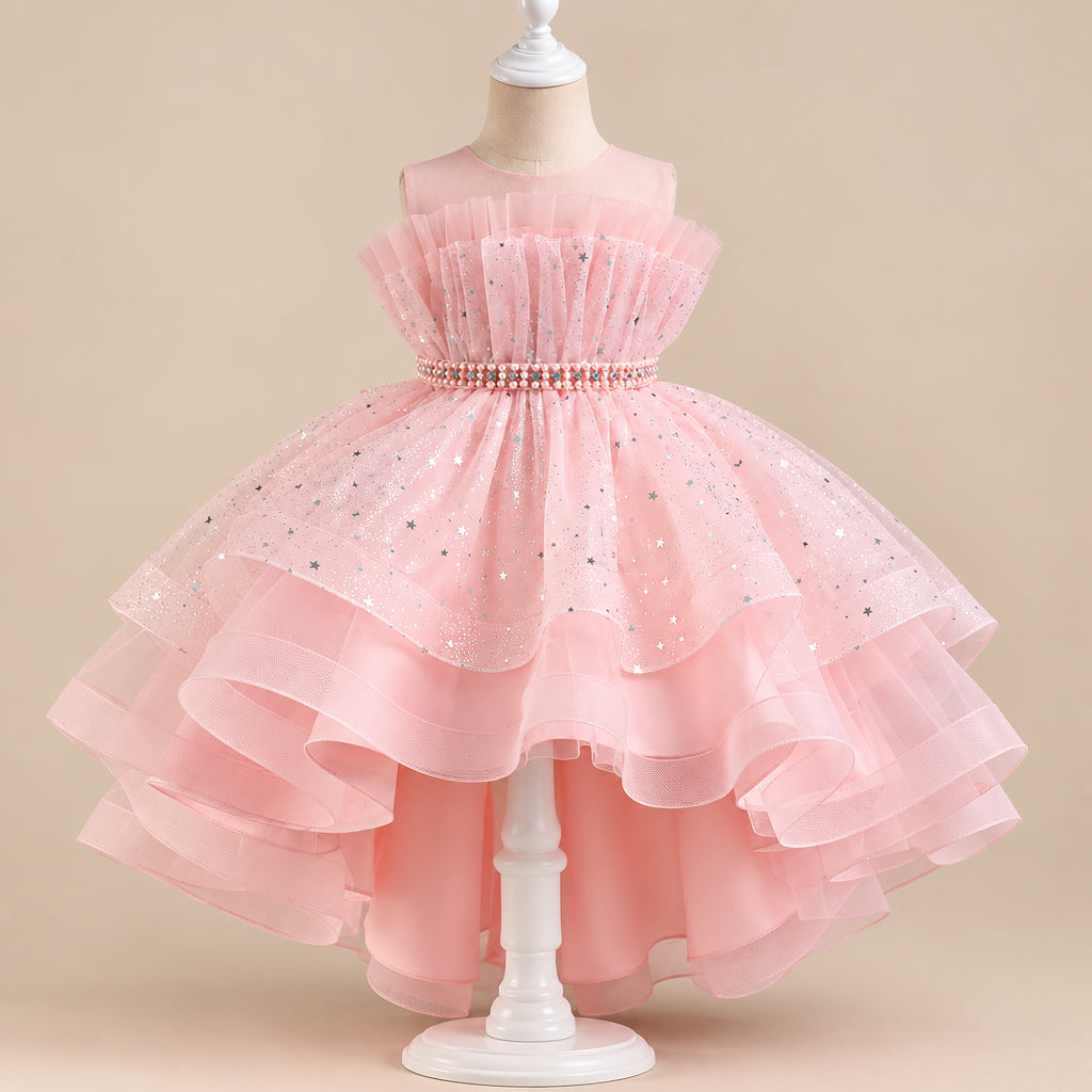 Pink children's dress on a mannequin against a gray background